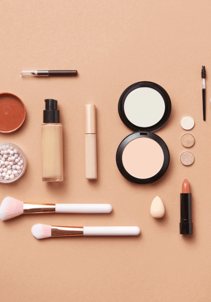 makeup brushes and lipstick and other makeup tools that one would need for their gym makeup routine. 