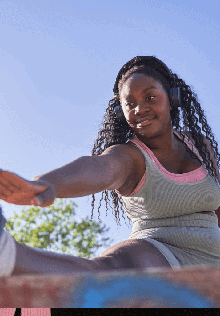 A woman stretching before a run so she can stay motivated on her fitness journey