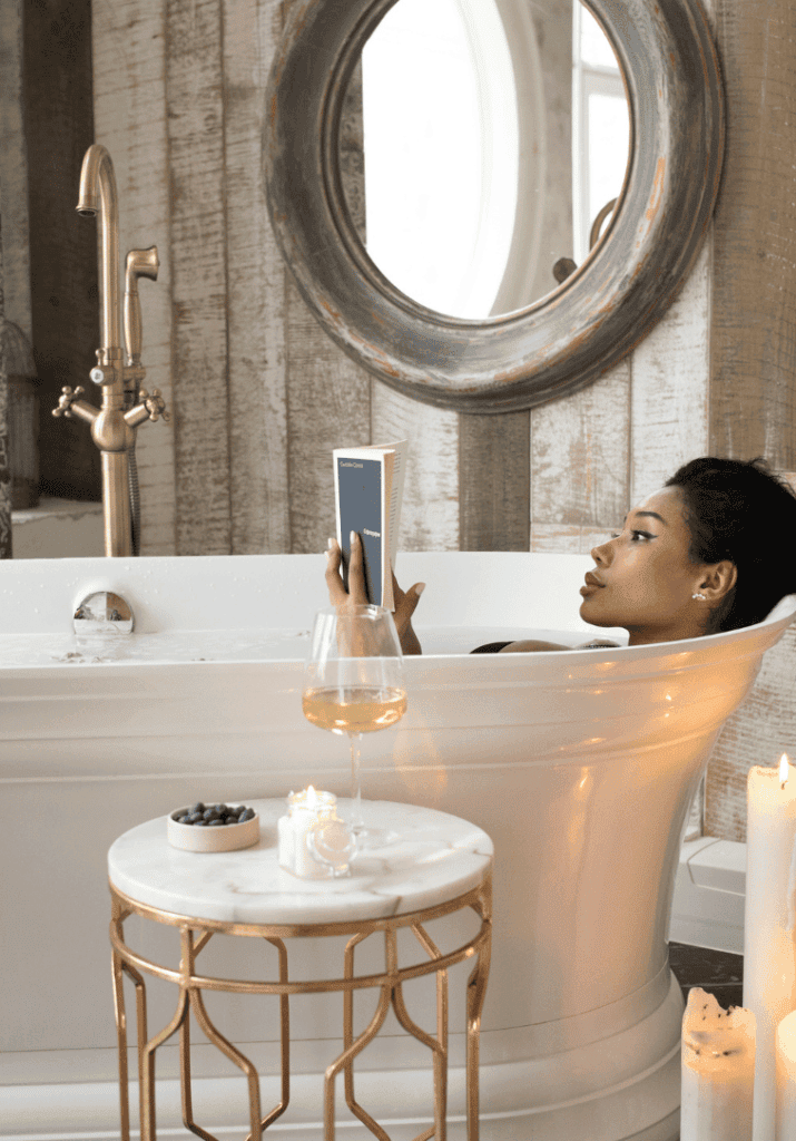 a woman reading a tub showing how she utlizes time management and reads when she can.