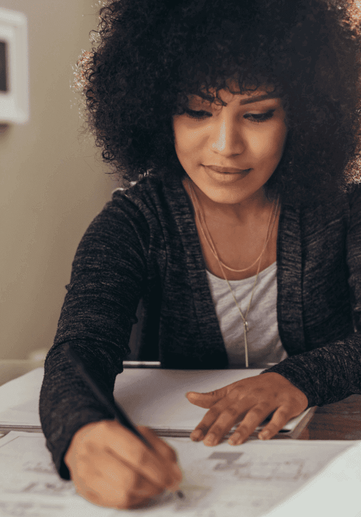 A woman using a planner to organize her life. 