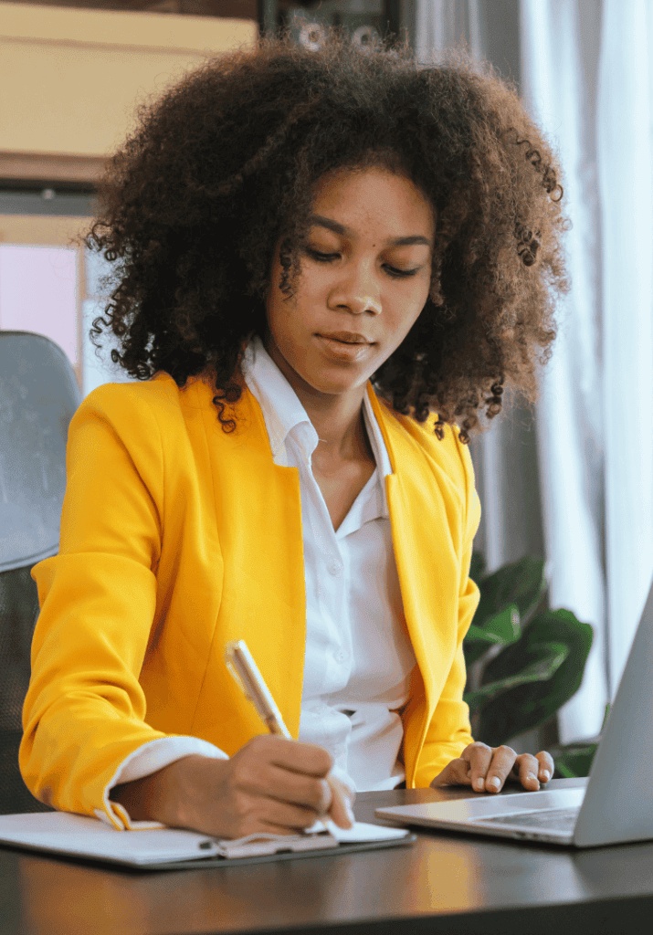 A woman working on building personal productivity systems in her life.