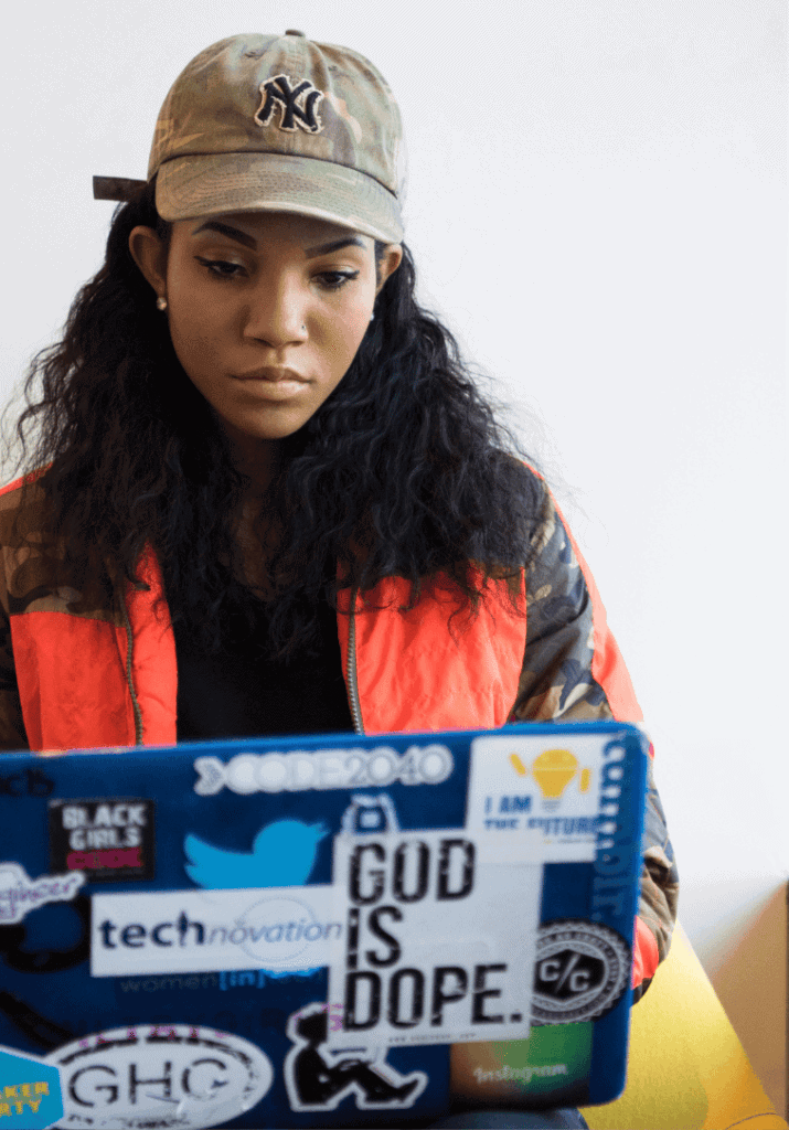 Black woman working on her laptop aligning her passion with productivity!