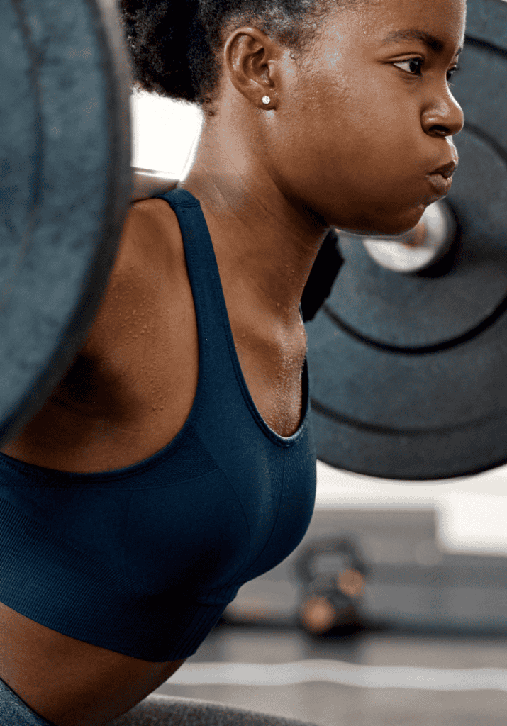 a woman lifting heavy weights