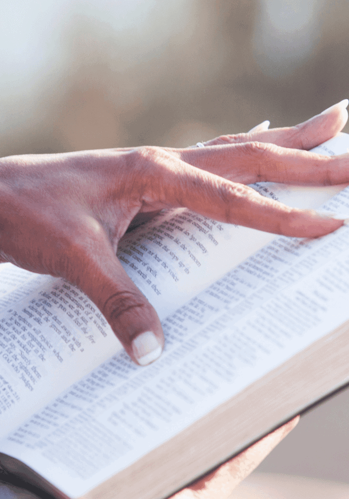a woman holding open her non fiction book
