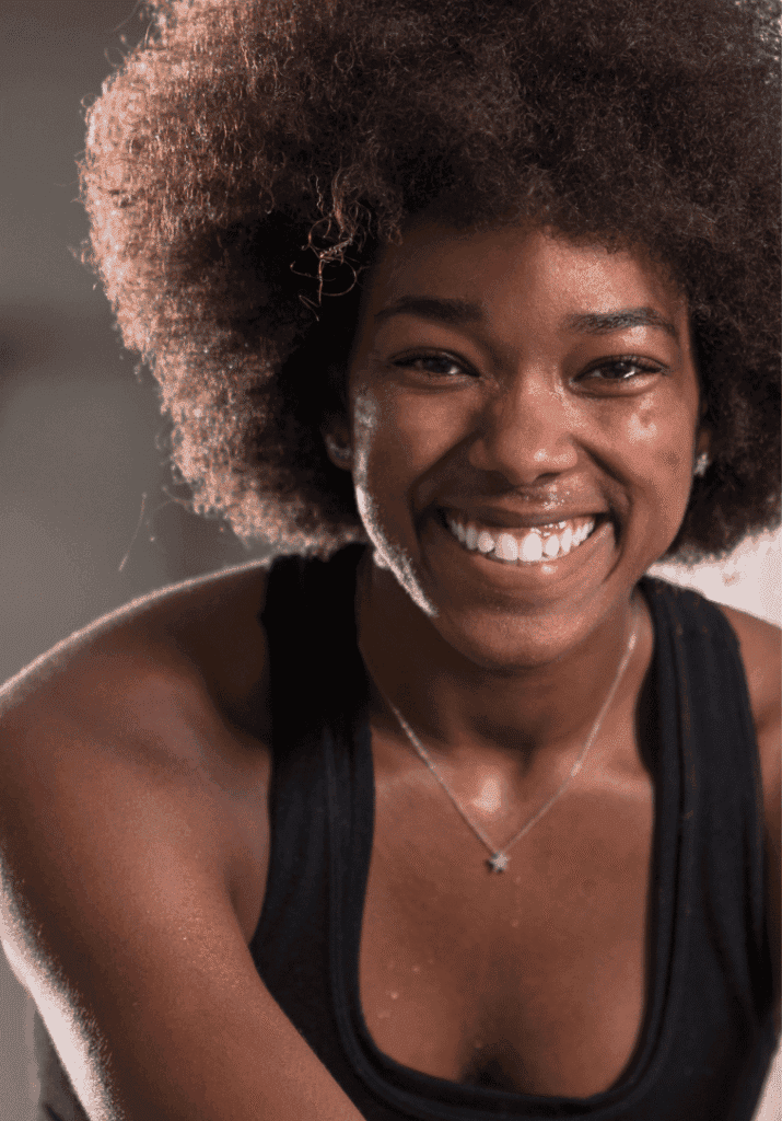 black woman smiling at the gym 