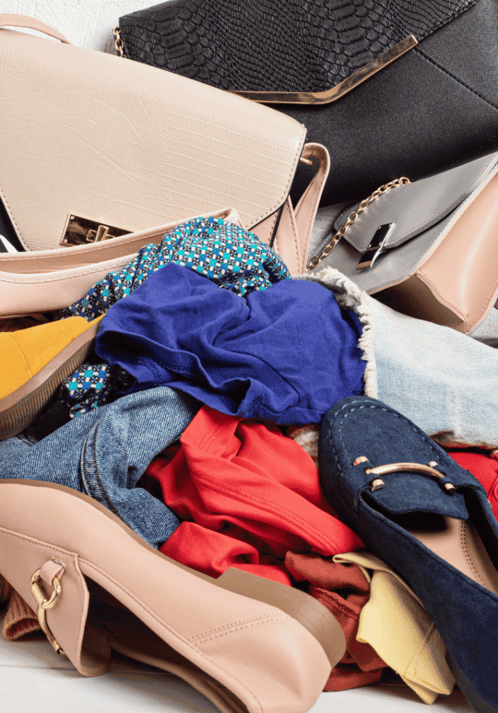 clothes and shows piled on one another to show over consumption
