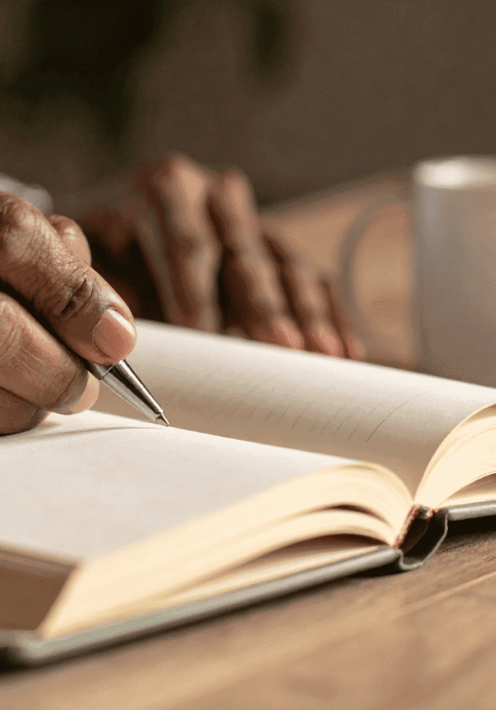 Someone writing down their goals