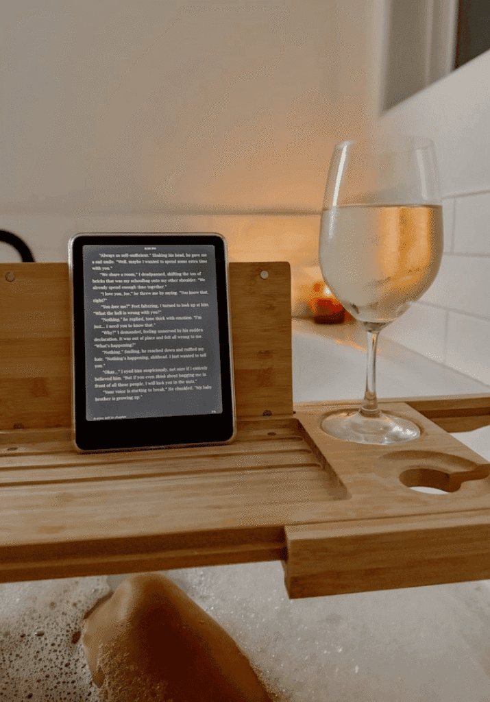 cozy gift idea for book lovers showing a bathtub tray caddy to hold a kindle