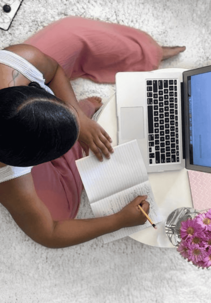 a woman on her laptop learning to prioritize herself