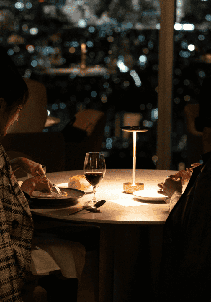Group of friends enjoying food and drinks at happy hour, representing affordable after work activities and weeknight routines